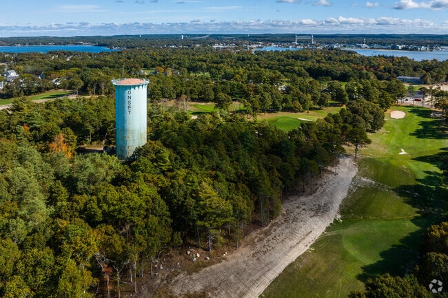Onset Water Tower looks proud over acres of lush green forest towards the Bourne Bridge.