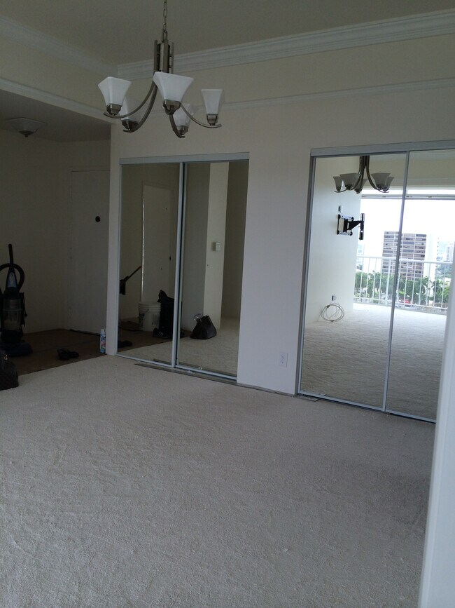 Living Room View into Living Room from 2nd Bedroom / / Living Room Closet with Mirror Sliding doors - 1710 Punahou St