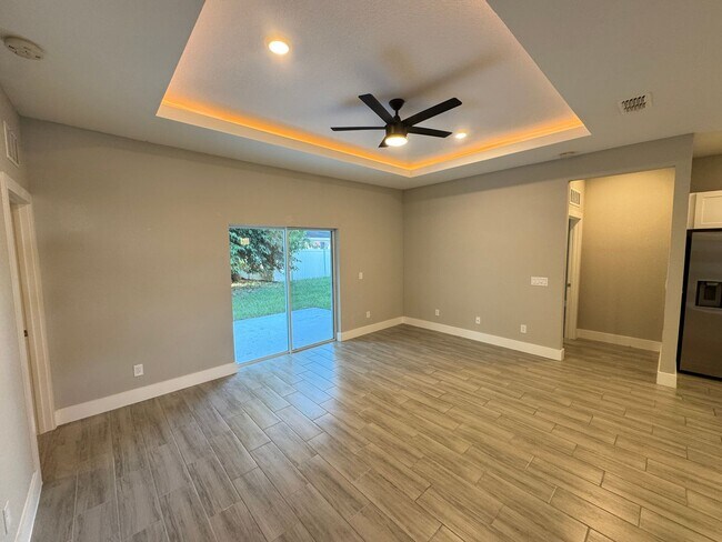 Building Photo - $300 off of a month of rent!! BEAUTIFUL 4 Bedroom, 2 Bathroom BRAND NEW Home in Poinciana!! CABLE...