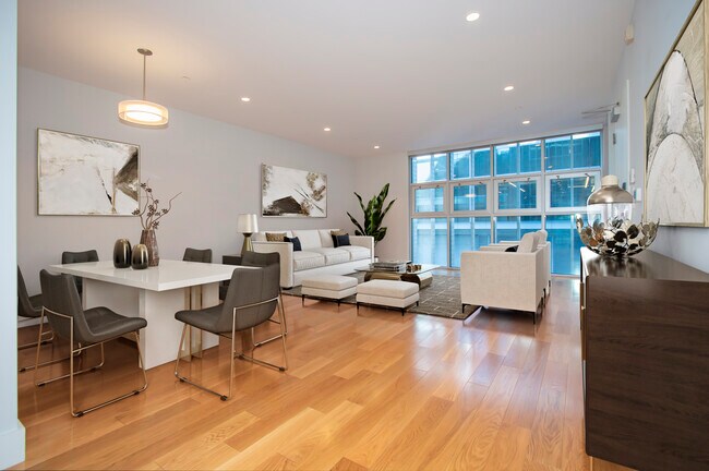 open dining & living area with floor-to-ceiling windows - 19 Tehama St