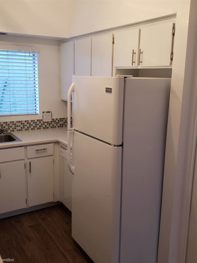 Building Photo - 1 br, 1.5 bath Condo - 6945 E 2nd St