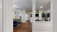 Located at 3323 McCue Rd in Houston's 77056 corridor, this 2-bedroom, 2-bathroom residence offers a cohesive and functional layout across a single floor. The living room features rich dark hardwood flooring, crown molding, a tray ceiling with a ceiling fan, and a large window with exterior door access that fills the space with natural light. Adjacent to the living area, a dedicated dining space flows seamlessly into the kitchen, which is outfitted with dark shaker-style cabinetry, a mosaic tile backsplash, stainless steel appliances, granite countertops, and a peninsula with bar seating — ideal for casual dining or entertaining.

The primary bedroom is generously proportioned, featuring plush carpeting, a ceiling fan, and a large window. Its en-suite bathroom includes a dual-sink vanity with dark cabinetry, a framed mirror, and warm vanity lighting. The second bedroom is equally comfortable, also with carpeting and a ceiling fan. The second bathroom offers dark cabinetry, a countertop vanity, and a shower with curtain. Three closets provide ample storage throughout. A dedicated in-unit laundry room with a full-size washer and dryer completes this well-rounded residence.