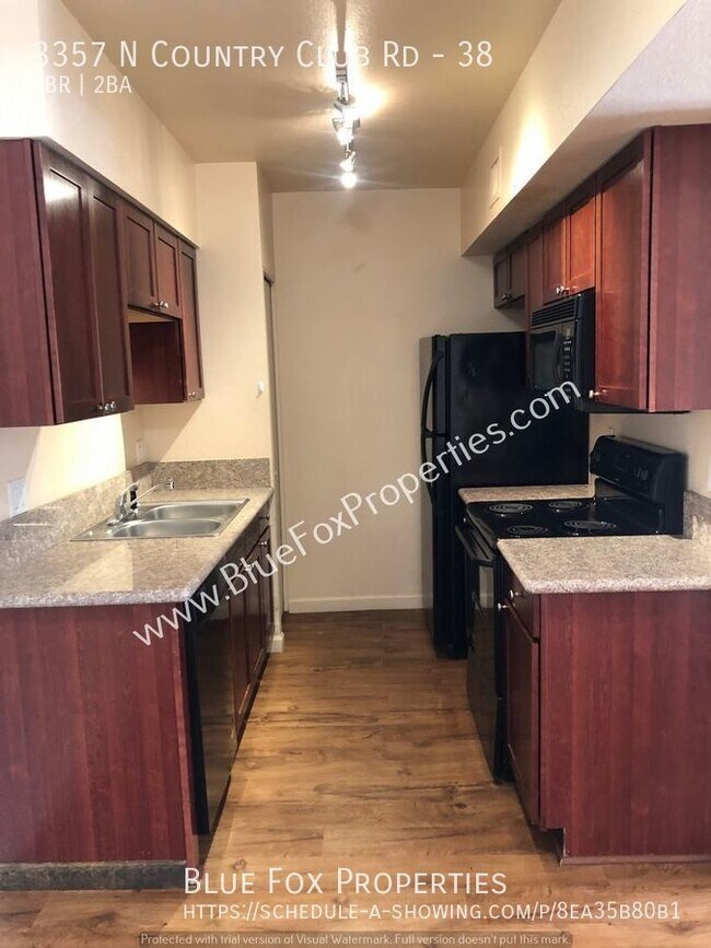 Building Photo - 3357 N Country Club #38