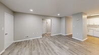 Located at 1700 RT 37 W in Toms River, NJ, this single-story, two-bedroom, one-bathroom home offers a thoughtfully designed layout with clean, modern finishes throughout. Light-toned luxury vinyl plank flooring flows seamlessly across all living areas, creating a cohesive and contemporary feel.

The updated kitchen is a standout feature, showcasing crisp white shaker-style cabinetry, marble-look countertops, a gas range, dishwasher, and a full-size refrigerator. A window above the sink allows natural light to brighten the workspace. The kitchen connects to a dedicated dining area, making it ideal for everyday living and entertaining.

The open living and dining rooms are generously proportioned, with recessed lighting and windows that invite natural light. The neutral gray walls and clean white trim lend a fresh, move-in-ready aesthetic throughout.

Both bedrooms feature soft blue-gray walls and vinyl plank flooring. The spacious primary bedroom is well-appointed with multiple closets, offering excellent storage. The second bedroom also includes a closet and a window with outdoor views.

The bathroom is efficiently arranged with a vanity, medicine cabinet mirror, and a tub-shower combination. A hallway connects the living spaces to the bedrooms, with additional closets providing ample storage. This home presents a clean, functional layout well-suited for comfortable single-floor living.