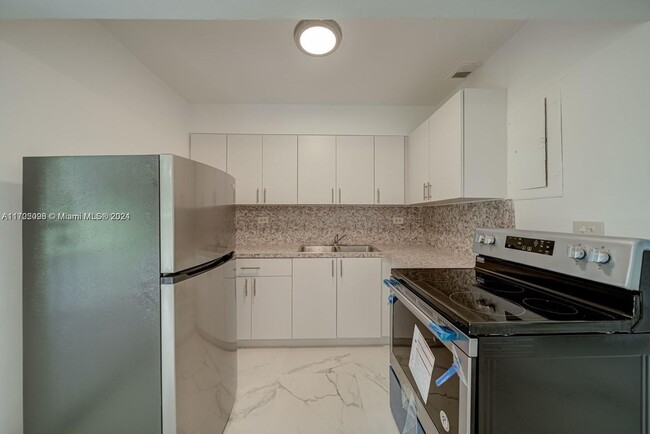 Building Photo - This two-bedroom, one-bath unit is ideally...