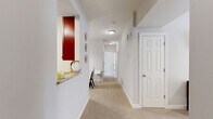 Located at 111 Cheswick Cir in Yorktown, Virginia, this single-floor residence offers a thoughtfully designed layout with 2 bedrooms, 2 bathrooms, and a well-organized collection of living spaces. The living room is bright and welcoming, featuring an arched window that draws in natural light, neutral-toned walls, and a ceiling fan overhead. Adjacent to it, the dining room provides a dedicated space for meals, accented by a pendant light fixture. The kitchen is well-appointed with rich dark wood cabinetry, granite countertops, stainless steel appliances, and tile flooring, offering both style and functionality. A pass-through counter connects the kitchen to the hallway, enhancing the open feel of the space. The carpeted hallway leads efficiently to all rooms throughout the home. The spacious primary bedroom includes a ceiling fan and a closet, while the second bedroom also features carpet flooring, a ceiling fan, natural light from a window, and its own closet. Both bathrooms are finished with granite-topped dark wood vanities and tub-shower combinations with tile surrounds. Additional features include three closets for generous storage and a dedicated laundry area, rounding out this practical and well-finished home.
