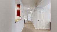 Located at 111 Cheswick Cir in Yorktown, Virginia, this single-floor residence offers a thoughtfully designed layout with 2 bedrooms, 2 bathrooms, and a well-organized collection of living spaces. The living room is bright and welcoming, featuring an arched window that draws in natural light, neutral-toned walls, and a ceiling fan overhead. Adjacent to it, the dining room provides a dedicated space for meals, accented by a pendant light fixture. The kitchen is well-appointed with rich dark wood cabinetry, granite countertops, stainless steel appliances, and tile flooring, offering both style and functionality. A pass-through counter connects the kitchen to the hallway, enhancing the open feel of the space. The carpeted hallway leads efficiently to all rooms throughout the home. The spacious primary bedroom includes a ceiling fan and a closet, while the second bedroom also features carpet flooring, a ceiling fan, natural light from a window, and its own closet. Both bathrooms are finished with granite-topped dark wood vanities and tub-shower combinations with tile surrounds. Additional features include three closets for generous storage and a dedicated laundry area, rounding out this practical and well-finished home.