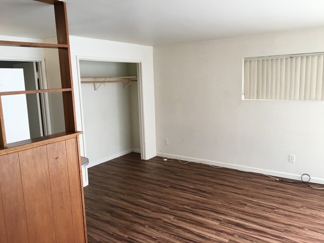 living room with closet - 4 62nd Pl