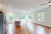 This contemporary 1-bedroom apartment in Fairfax, VA, offers a generous 1020 square feet of living space on a single floor. The open-concept design seamlessly integrates the kitchen, living, and dining areas, creating a spacious and airy atmosphere. Gleaming hardwood floors run throughout, adding warmth and elegance to the interior.

The kitchen is a standout feature, boasting light-colored cabinetry, stainless steel appliances, and a central island, perfect for meal preparation or casual dining. Large windows in the living area and bedroom flood the space with natural light and provide picturesque views of the surrounding landscape.

The primary bedroom, measuring 170 square feet, offers ample space and includes a built-in closet for storage. Two well-appointed bathrooms feature modern fixtures, with at least one offering a combination tub and shower.

Additional amenities include recessed lighting, ceiling fans, and what appears to be a split-system air conditioner for climate control. The apartment's neutral color palette and clean lines create a canvas for various decorating styles, making it an ideal space for comfortable, modern living.