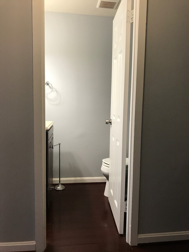 Half bath conveniently located off entry hallway for guests - 1200 23rd Street Northwest