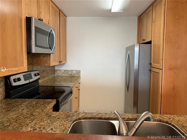 Building Photo - 8233  Harding Ave  302