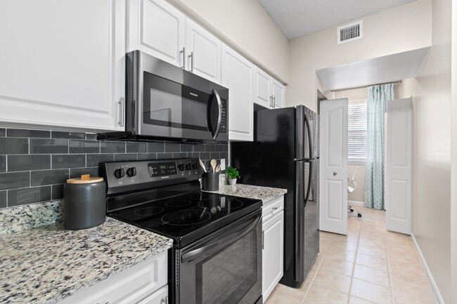 Kitchen with Stainless Steel Appliances at Verona at Boynton Beach Apartments in Boynton Beach, FL 33426 - Verona at Boynton Beach