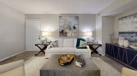 Located in Brookhaven, Georgia, this well-appointed one-bedroom, one-bathroom residence offers a thoughtfully designed single-level layout that maximizes every square foot. The open-concept living and dining area forms the heart of the home, bathed in natural light through large windows dressed with floor-to-ceiling draping. The living room features wood-look flooring, a neutral color palette, and a warm, inviting ambiance well-suited for both relaxing and entertaining. A dedicated dining nook accommodates a full table setting beneath a modern pendant light, adding a refined touch to everyday meals. The kitchen is outfitted with crisp white cabinetry, quartz countertops, a classic subway tile backsplash, and stainless steel appliances, delivering a clean and contemporary aesthetic. The bedroom offers a comfortable, carpeted retreat with a ceiling fan, natural light from a window with blinds, and ample closet storage. The full bathroom includes a tub-shower combination with white tile surround and wood-look flooring. A dedicated in-unit laundry area with a full-size washer and dryer adds everyday convenience. Throughout the space, consistent finishes and a cohesive neutral tone create a polished, move-in-ready environment.