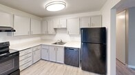 Located at 4910 123rd St SW in Lakewood, Washington, this 2-bedroom, 2-bathroom single-floor residence offers a well-organized and functional layout. The combined living and dining area is a welcoming centerpiece, featuring light-toned luxury vinyl plank flooring, neutral-toned walls, a textured ceiling, and multiple windows fitted with blinds that allow natural light to fill the space. Baseboard heating is present throughout the main living areas.

The kitchen is equipped with white cabinetry, light countertops, a stainless sink, a dishwasher, and a full-size refrigerator. A sliding glass door leads directly to a private patio overlooking a lush, green outdoor setting, bringing in additional natural light and providing a pleasant outdoor connection.

Both bedrooms are carpeted and feature sliding-door closets and ceiling fans with integrated lighting. The spacious primary bedroom offers generous proportions and ample closet storage. The two bathrooms are clean and efficiently designed — one includes a tub/shower combo with brushed nickel fixtures and grab bars, while the other features a walk-in shower. An in-unit laundry area and hallway with additional closets round out this practical and comfortable residence.