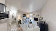 Located at 409 E William Cannon Dr in Austin, TX, this well-appointed one-bedroom, one-bathroom unit offers a thoughtfully designed single-floor layout that maximizes every square foot. The living room serves as the heart of the home, featuring a tile-surround fireplace, wood-look flooring, a textured ceiling, and a sliding glass door that floods the space with natural light while providing access to an outdoor area. The kitchen is efficiently arranged with gray cabinetry, granite-style countertops, a double-basin stainless steel sink, and modern appliances—offering ample storage and functionality in a galley-style configuration. The bedroom is a comfortable retreat, complete with a ceiling fan, wood-look flooring, a dedicated closet, and its own sliding glass door that opens to the outdoors, bringing in natural light and a connection to the exterior. The full bathroom is finished with large-format tile surrounding a tub-shower combination, complemented by coordinating floor tile and clean, neutral fixtures. A dedicated closet provides additional storage within the unit. With a neutral color palette, consistent flooring throughout, and practical finishes, this unit delivers a cohesive and functional living environment in a convenient Austin location.
