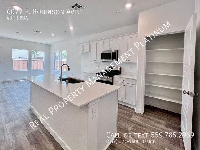 Building Photo - 6077 E Robinson Ave