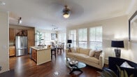Located at 7510 Burgoyne Rd in Houston's vibrant 77057 corridor, this well-appointed single-floor residence offers a seamless blend of comfort and functionality. The open-concept living and dining area is anchored by rich hardwood flooring, crown molding, and an abundance of natural light streaming through large windows dressed with classic wood blinds. A ceiling fan adds a finishing touch to the inviting living space.

The kitchen is a standout feature, outfitted with warm wood cabinetry, granite countertops, stainless steel appliances — including a refrigerator, range, and built-in microwave — and a breakfast bar ideal for casual dining. The adjacent dining area accommodates a full-sized table and enjoys garden views through dual windows.

The bedrooms offer a peaceful retreat, each with plush carpeting, ample natural light, and ceiling fans. The primary bedroom is generously sized, while the bathrooms feature tile flooring, granite-topped vanities with wood cabinetry, and well-lit mirrors. A dedicated in-unit laundry area with a full-sized washer and dryer adds everyday convenience. Throughout, the warm neutral palette and thoughtful layout create a cohesive, comfortable living environment.