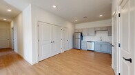 Located at 1060 Crest Way in York, PA, this single-floor, 3-bedroom, 2-bathroom unit offers a thoughtfully designed layout with modern finishes throughout. The combined kitchen and living area serves as the heart of the home, featuring light wood-style luxury vinyl flooring, recessed lighting, and a clean, open feel. The kitchen is well-equipped with gray shaker-style cabinetry, white countertops, and a full suite of stainless steel appliances including a refrigerator, dishwasher, electric range, and built-in microwave. The bedrooms are carpeted for comfort and each features a window with natural light and outdoor views. The spacious primary bedroom includes a dedicated walk-in closet outfitted with wire shelving for organized storage. The two bathrooms continue the unit's cohesive design with gray vanity cabinetry, white countertops, and wood-style flooring. One bathroom features a walk-in shower, while the other is equipped with a shower-tub combination. Crisp white walls and consistent finishes throughout create a bright, move-in-ready atmosphere that balances practicality with modern style.
