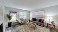 Located at 1600 Winters Creek Dr in Atlanta, GA, this single-floor residence offers a well-organized layout designed for comfortable everyday living. The living room serves as the centerpiece of the home, featuring wood-style flooring, large windows with blinds that allow ample natural light, and a classic fireplace that adds warmth and character to the space. Neutral gray walls and textured ceilings carry throughout, creating a cohesive and calming aesthetic. Adjacent to the living area is a dedicated dining room, defined by chair-rail molding and a stylish overhead light fixture — an ideal setting for gatherings. The kitchen is appointed with white cabinetry, granite-style countertops, stainless steel appliances including a refrigerator and electric range, and a tasteful gray subway tile backsplash, all set over light wood-style flooring. The primary bedroom features plush carpeting and a walk-in closet, while the second bedroom benefits from sliding glass door access to the outdoors and abundant natural light. The bathroom includes a full tub-shower combination with clean white tile surround. Throughout the residence, consistent finishes and thoughtful design details contribute to a polished and inviting atmosphere.