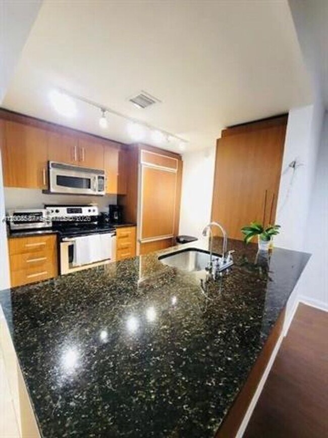 Building Photo - 10275 Collins Ave