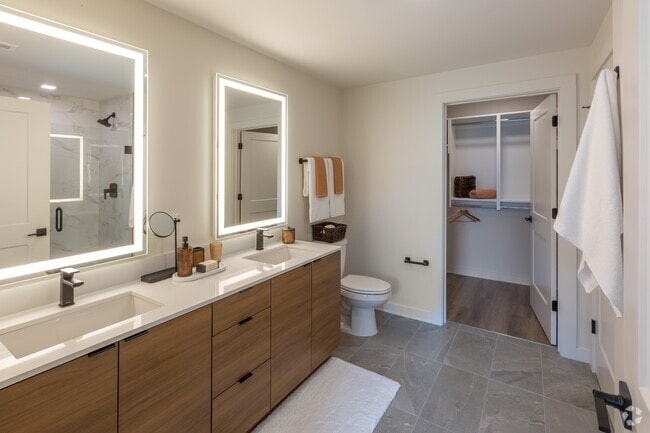 Backlit Vanity Mirror in All Bathrooms | A6 Wood Scheme | 1 Bedroom | 873 Sq. Ft. - Loria Ansley