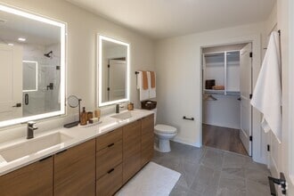 Backlit Vanity Mirror in All Bathrooms | A6 Wood Scheme | 1 Bedroom | 873 Sq. Ft. - Loria Ansley