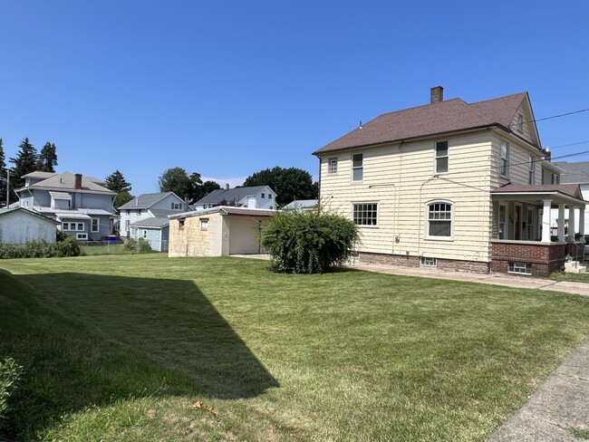 Double lot makes for a big yard. Lawn maintenance included. - 636 W 24th St