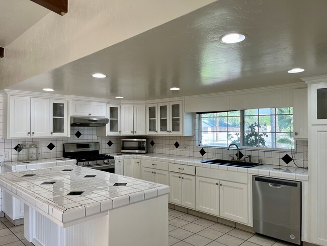 Updated kitchen with island. Stainless Steel appliances included. - 1235 N Prospect St