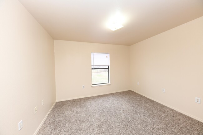 Cozy bedroom with carpet and overhead lighting - Chapel Ridge of Ripley