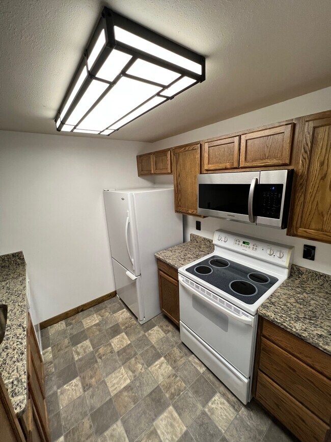 Kitchen right 1 - 6019 E 6th Ave