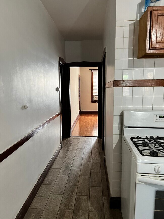 Kitchen hallway to living room - 4104 S Rockwell St