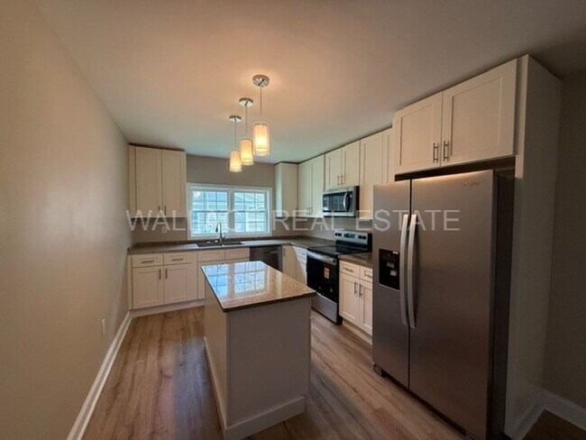 Building Photo - TOTALLY RENOVATED 3 BEDROOM HOUSE MINUTES FROM NEW SMOKIES STADIUM!!