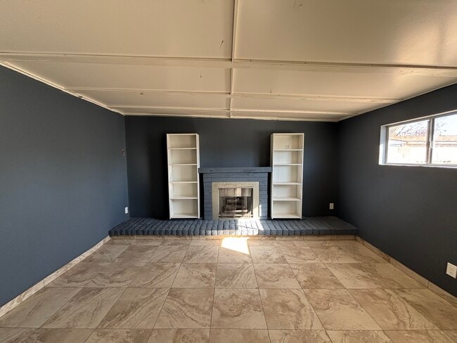 Family room with gas fireplace - 7261 W Camelback Rd House