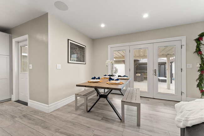 Dining room area with access to pool from French doors - 3109 N Studebaker Rd