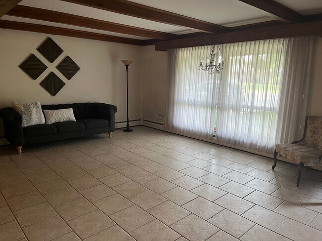Building Photo - Three Bedroom partial furnished house