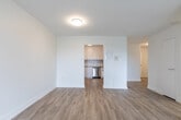 Located at 1580 Adelaide St N in London, Ontario, this 1-bedroom, 1-bathroom unit offers a thoughtfully designed layout across a single floor. Light wood-style flooring flows consistently throughout, creating a clean, cohesive aesthetic complemented by crisp white walls and trim.

The spacious living room is bathed in natural light through a large sliding window that frames a green outdoor view, lending the space an open and airy feel. It connects seamlessly to the kitchen, which features light cabinetry, a tiled backsplash, and stainless steel appliances including a refrigerator.

The bedroom is a comfortable, well-proportioned room with its own window offering pleasant outdoor views and a full-width built-in closet with sleek sliding doors, providing generous storage. The entrance area includes additional closet space, offering practical organization from the moment you step in.

The bathroom is finished with classic white subway tile surrounding a full soaker tub and shower combination, accented with chrome fixtures for a timeless, clean look. A dedicated laundry area adds everyday convenience to the unit's functional design.

Overall, the space presents a bright, modern, and move-in ready environment with a neutral palette that suits a variety of personal styles.