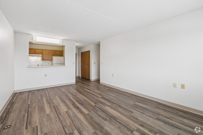 2BR, 1BA - 782SF - Living Room and Kitchen - Como by the Lake Senior Apartments