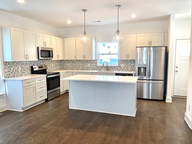 Brand new cabinets, countertops, and appliances in Kitchen - 1641 54Th Ave N