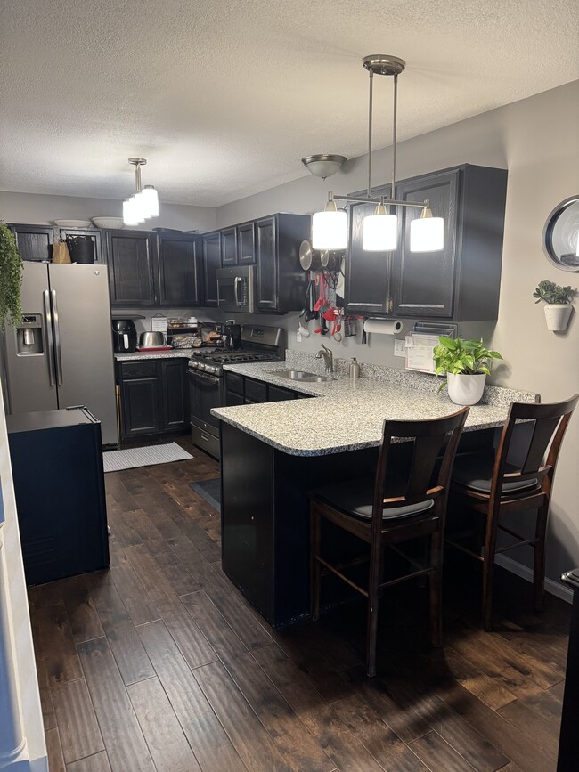 Kitchen with bar seating - 4430 104th St