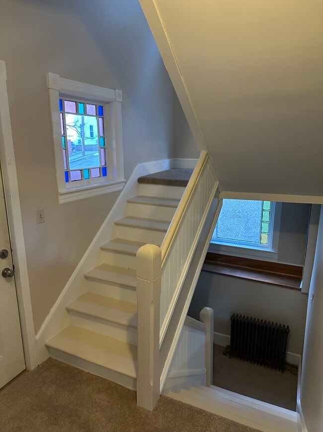 First floor entry way - split stairwell. - 203 Pleasant St