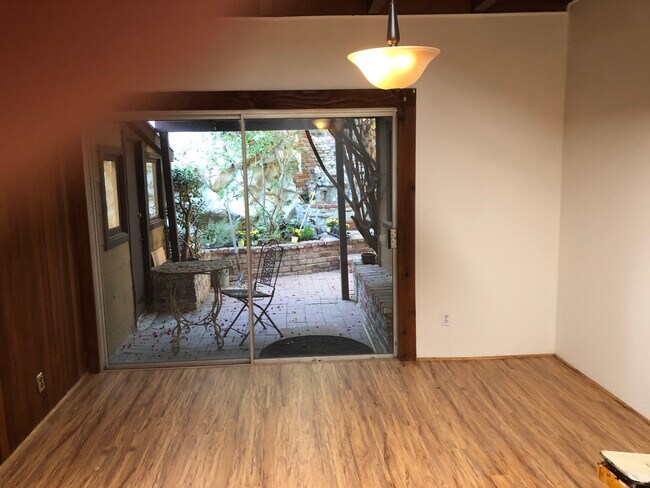dining room, gated backyard patio - 1931 Pinehurst Rd