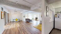 This one-bedroom, one-bathroom loft-style residence offers a thoughtfully designed single-floor layout that masterfully blends industrial aesthetics with modern livability. Throughout the space, rich hardwood floors provide a warm contrast to the exposed concrete ceilings with white-painted structural beams and piping — signature elements of classic loft architecture.

The expansive living room is the centerpiece of the home, bathed in natural light from large windows that frame impressive city skyline views. White-painted brick walls lend texture and character, while the open layout creates a generous sense of space and flow. A pendant light fixture adds a contemporary touch overhead.

The kitchen is efficiently designed with grey cabinetry, white subway tile backsplash, tile flooring, and full-size appliances including a refrigerator, electric range, dishwasher, and microwave — providing everything needed for everyday cooking.

The spacious primary bedroom is a bright, airy retreat, highlighted by a dramatic skylight that floods the room with natural light. Exposed piping and beams continue the industrial theme, while the hardwood floors and neutral walls keep the atmosphere calm and restful.

The bathroom features a full-size tub and shower combo with clean, white finishes. A dedicated closet and two hallways complete the functional layout of this distinctive urban residence.