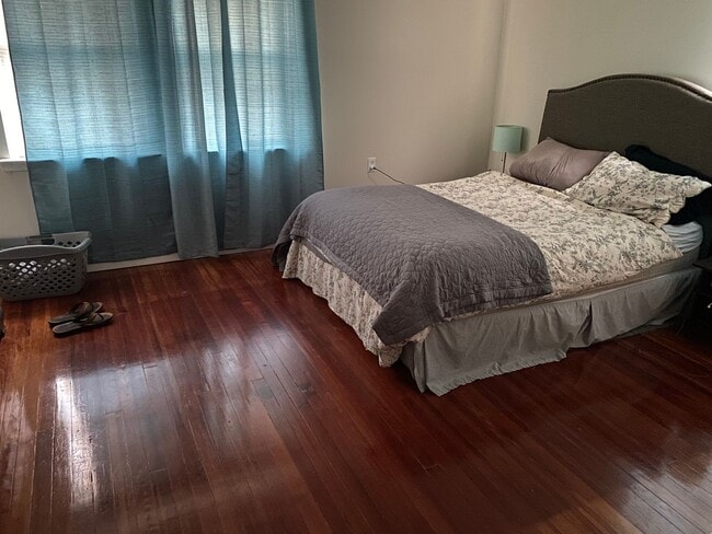 Photo - 3BR Twin Home | Hardwood Floors • Fenced Yard • Garage • W/D Included