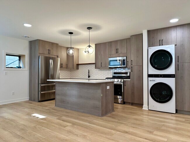 Large kitchen with gas range and dishwasher. - 4600 36th Ave S