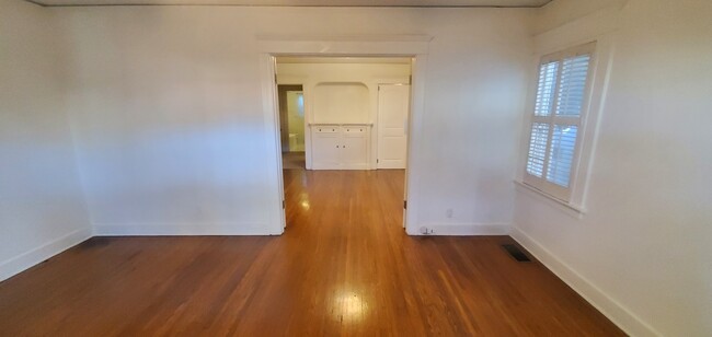 Living room has French double doors opening to the bedroom, bathroom and kitche - 1229 N Orange Grove Ave