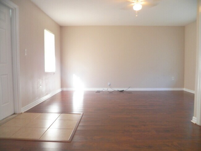 Building Photo - 3/2 Home W/ Wood Flooring!