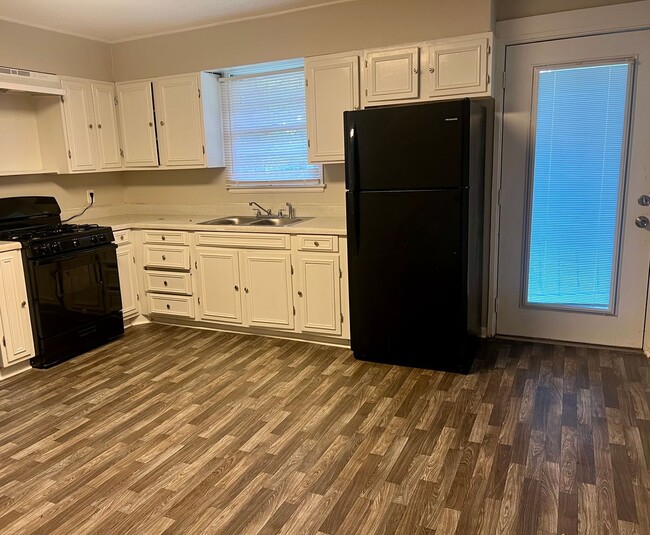 Building Photo - Available Now!! Lawn service included**