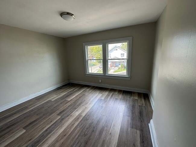 Large middle bedroom with two full-sized windows and closet.. - 738 Seymour Ave