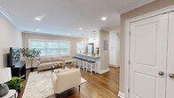 Located at 115 N Washington Ave in Bergenfield, NJ, this well-appointed one-bedroom, one-bathroom residence offers a cohesive and comfortable layout across a single floor. Rich hardwood flooring and crisp crown molding run throughout, lending a polished, classic character to the space.

The open-concept kitchen and living area serves as the heart of the home. The kitchen features white shaker cabinetry, gleaming granite countertops, stainless steel appliances, a tiled backsplash, and a breakfast bar illuminated by pendant lighting — ideal for both casual dining and entertaining. The living room is bright and welcoming, with recessed lighting, large windows that invite natural light, and ample room for comfortable seating arrangements.

The bedroom is a serene retreat, offering generous proportions, a ceiling fan, natural light from a dedicated window, and a double-door closet for substantial storage. The full bathroom is cleanly finished with white subway tile, a tub-shower combination with a tasteful mosaic accent tile border, and a dark-vanity with a white basin.

A dedicated laundry area with a stacked washer and dryer unit adds everyday convenience. A connecting hallway ties each room together efficiently, making the most of the well-organized floor plan.