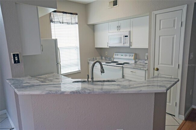 Building Photo - 9018 Lake Chase Island Way